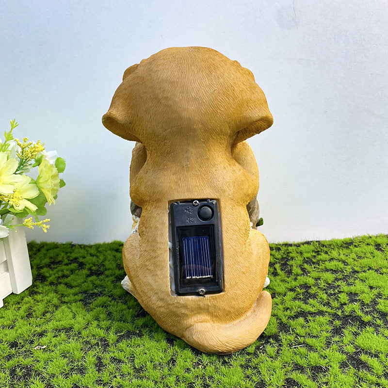 Solcelledrevet LED-hagelampe «Puppies Welcome» laget av harpiks
