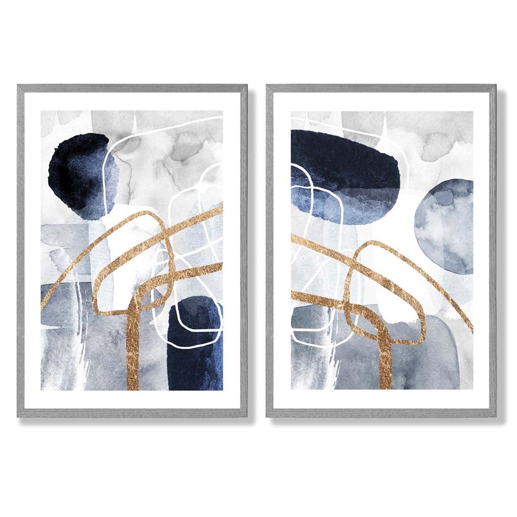 Sett med 2 kunsttrykk i abstrakt rammedesign i blått og gull