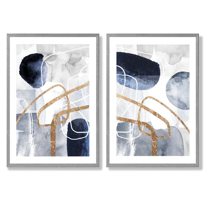 Sett med 2 kunsttrykk i abstrakt rammedesign i blått og gull