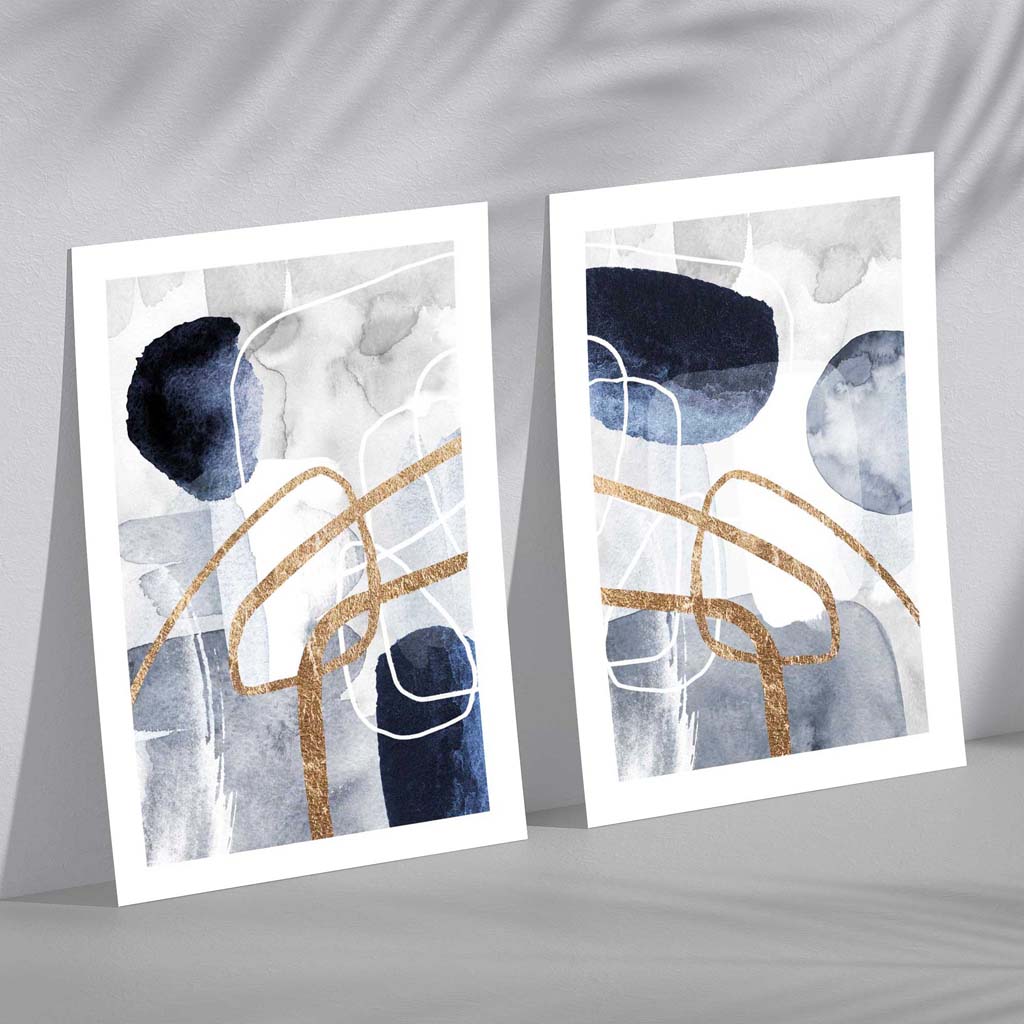 Sett med 2 kunsttrykk i abstrakt rammedesign i blått og gull