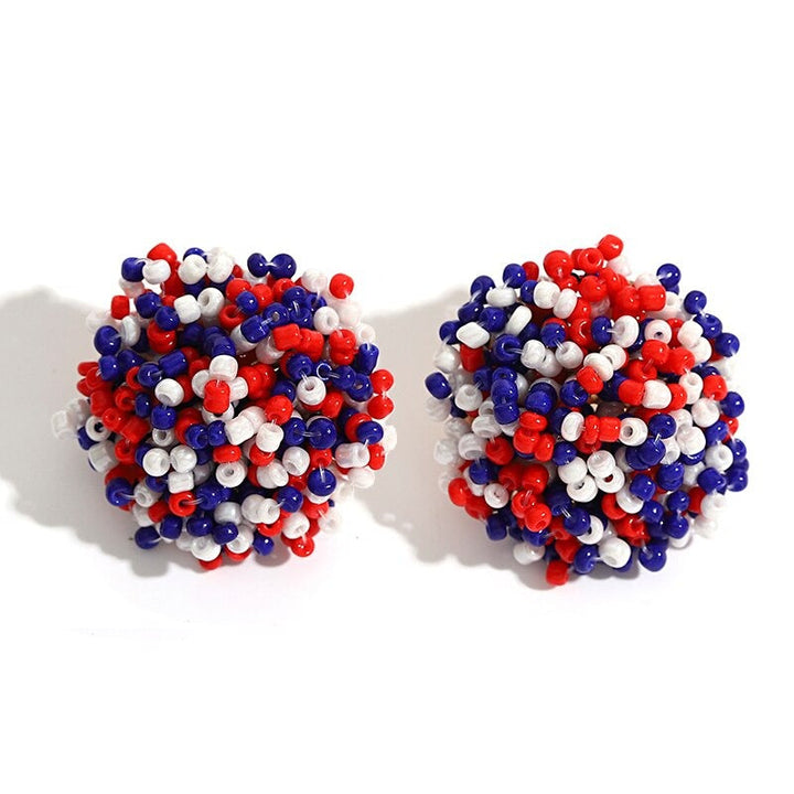Skanto | Lys og morsom håndlaget multicolor perle pompom stud øredobber