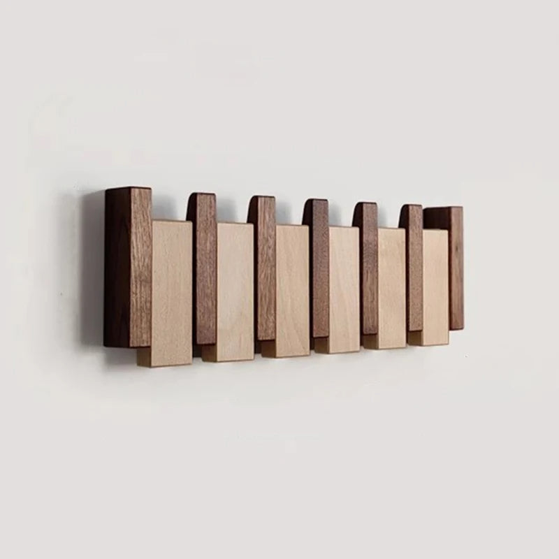 Tre vegghenger i piano design med sammenleggbare kroker | Skanto