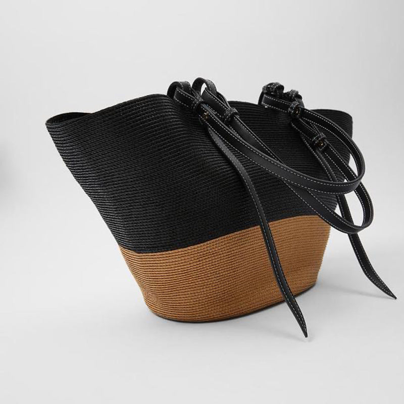 Generøs kurvveske med elegante lærdetaljer Skanto