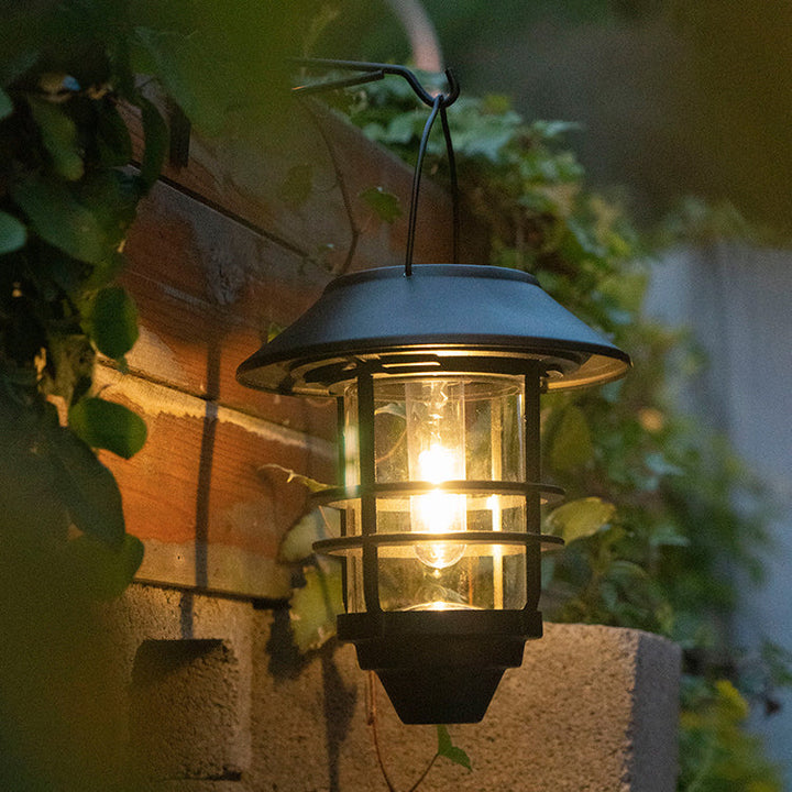 Moderne, retroinspirert, vanntett vegglampe laget av aluminium og glass med solcellefunksjon, sylindrisk, med én flamme, for oppheng på veggen til terrassen.