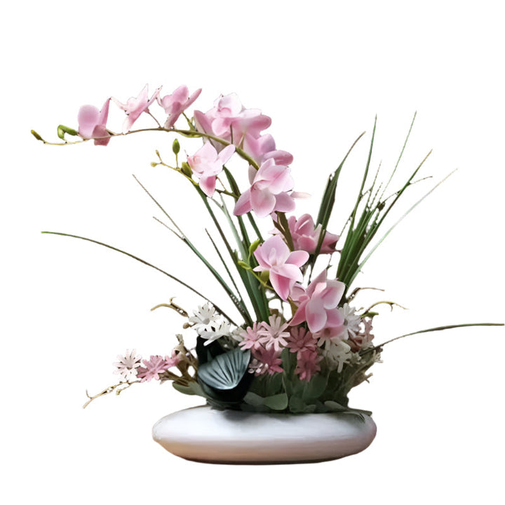 Livaktig blomsterarrangement i en moderne vase Skanto