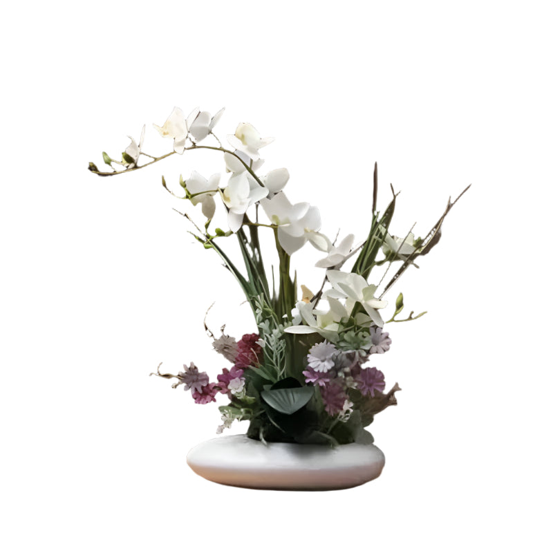 Livaktig blomsterarrangement i en moderne vase Skanto