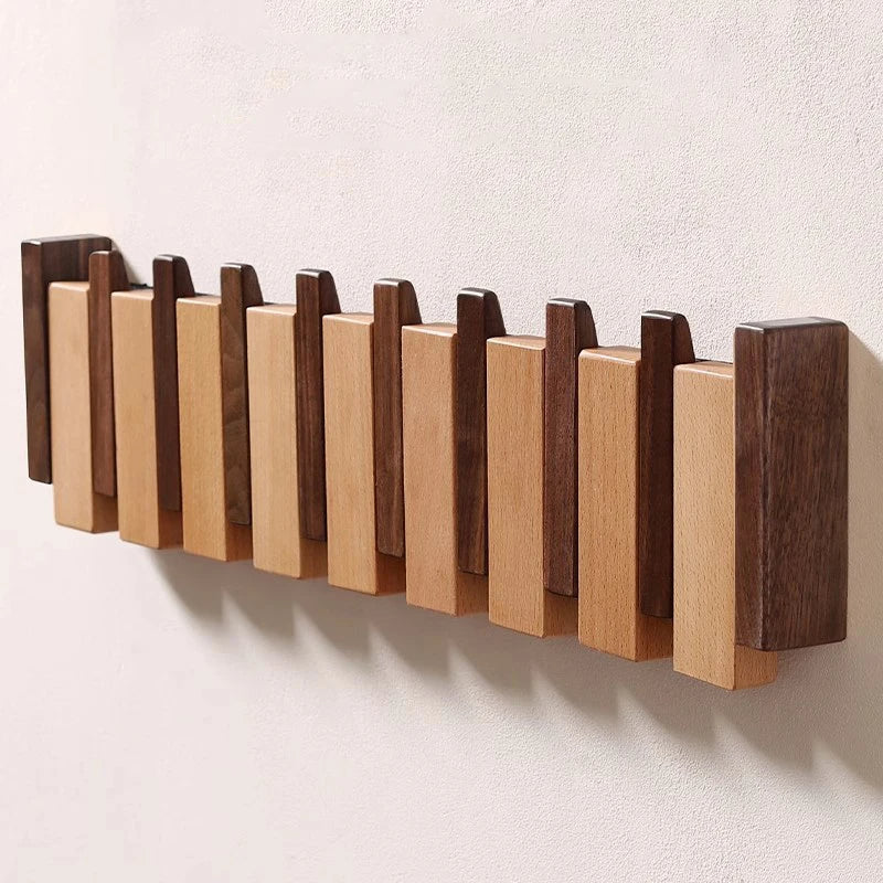 Tre vegghenger i piano design med sammenleggbare kroker | Skanto
