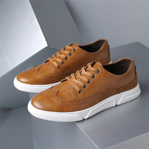 Brogue-sneakers i skinn med gummisåle