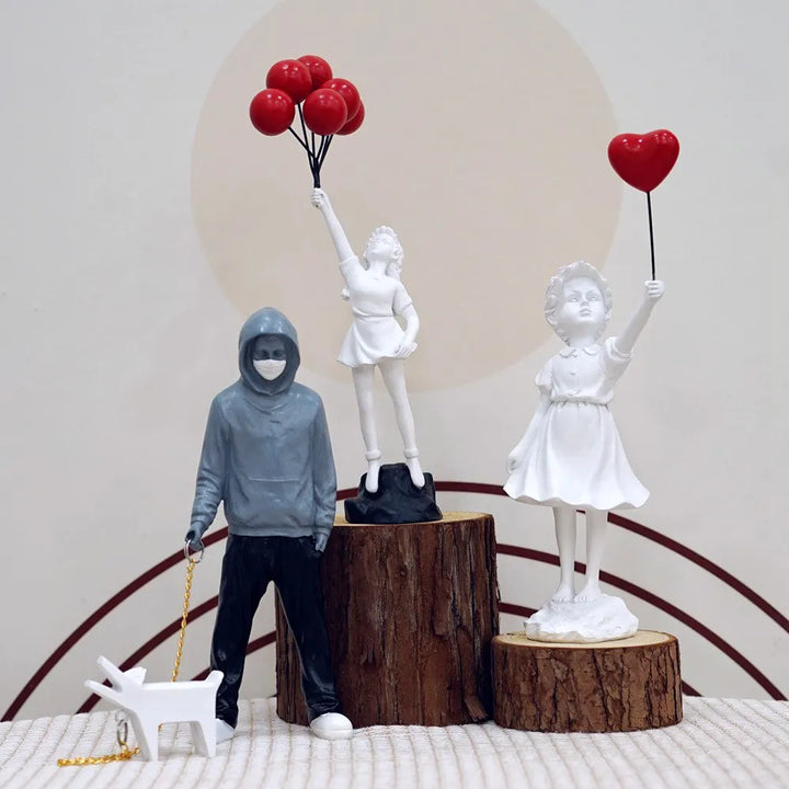 Skanto | Artify Banksy skulpturkolleksjon | Blomsterkaster & ballongjente | Popkunstfigurer | Moderne kontor- og hjemmeinnredning