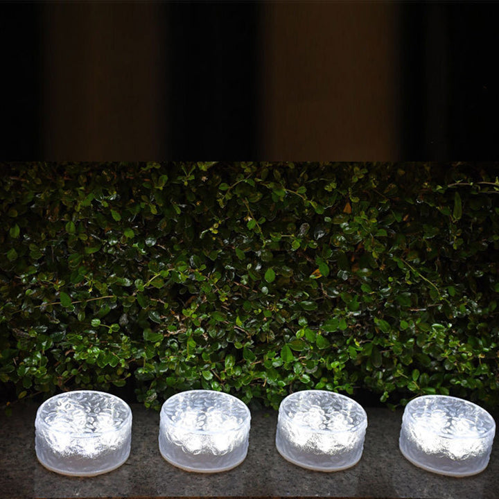 Rund LED-solcellelampe formet som en isblokk, laget av akryl for utendørs bruk