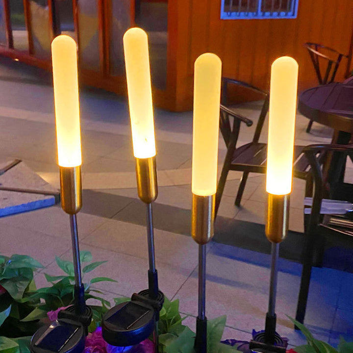 Vanntett solcelledrevet sylinderlampe laget av akryl, aluminium, rustfritt stål og ABS med LED-belysning for utendørs bruk og hagedesign.