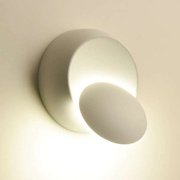 Skanto | Moderne nordisk jern rund eklips roterbar LED vegglampe for nattbord