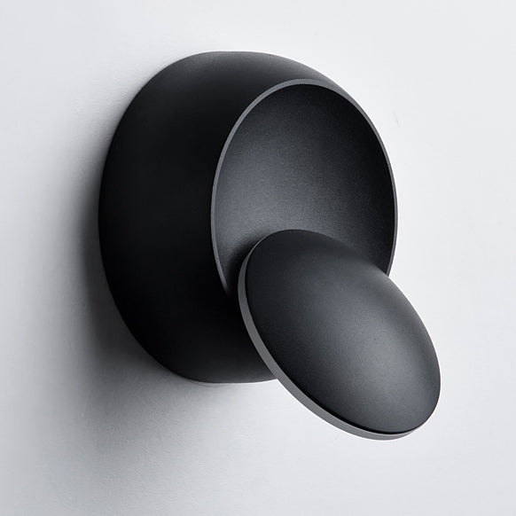 Skanto | Moderne nordisk jern rund eklips roterbar LED vegglampe for nattbord