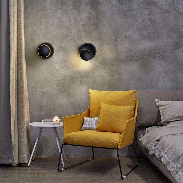 Skanto | Moderne nordisk jern rund eklips roterbar LED vegglampe for nattbord