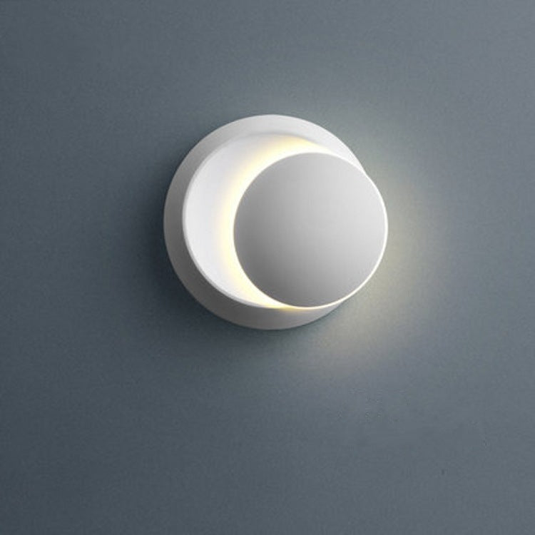 Skanto | Moderne nordisk jern rund eklips roterbar LED vegglampe for nattbord