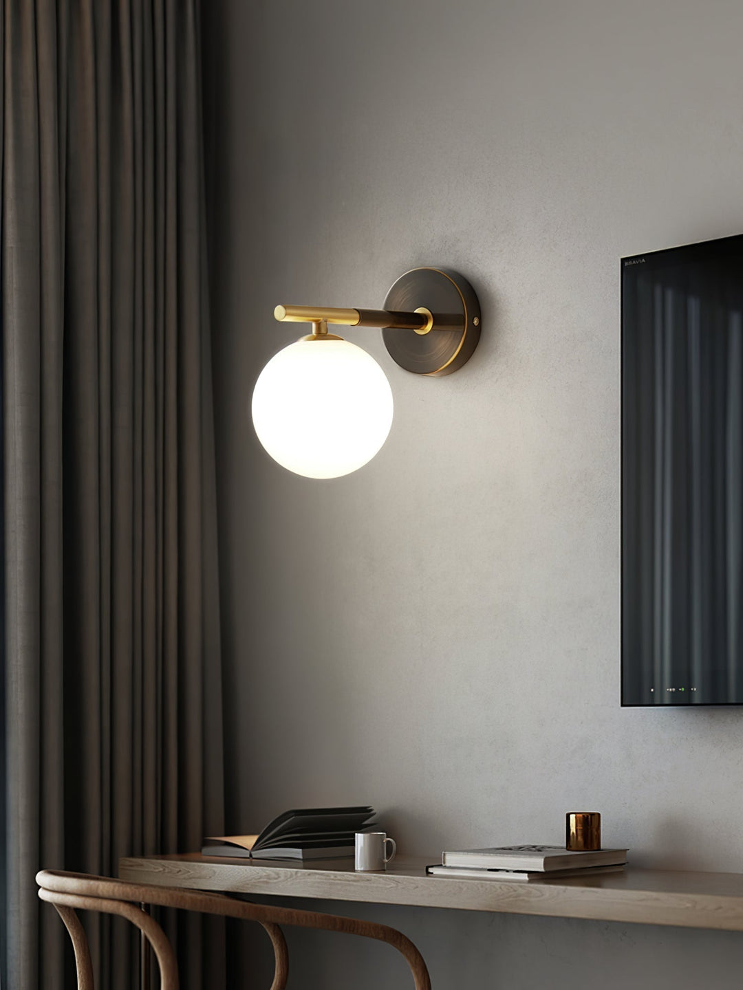 Skanto | GlobalGlow – Gullvegglampe med global inspirasjon