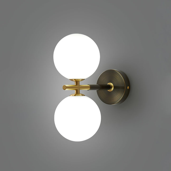 Skanto | GlobalGlow – Gullvegglampe med global inspirasjon
