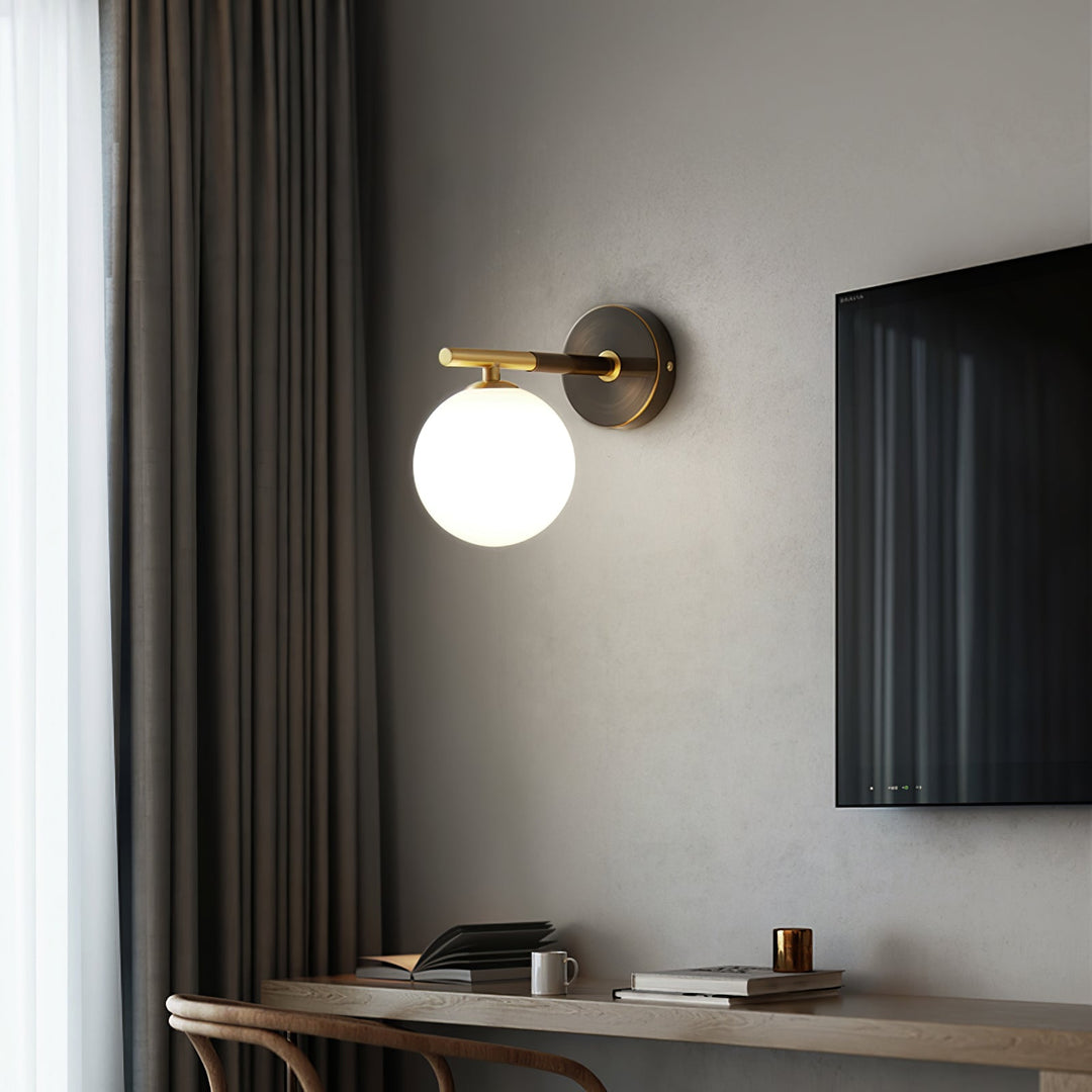 Skanto | GlobalGlow – Gullvegglampe med global inspirasjon