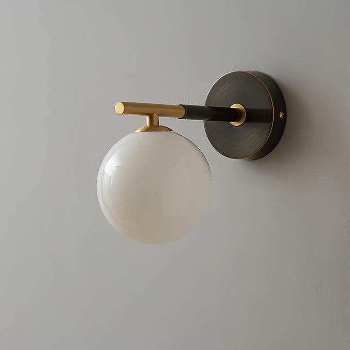 Skanto | GlobalGlow – Gullvegglampe med global inspirasjon