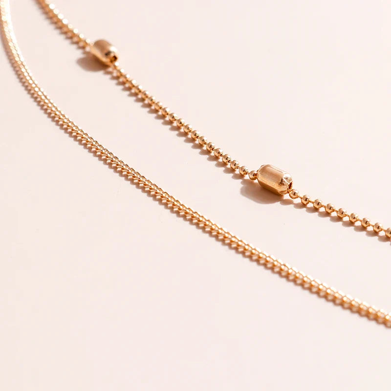 Skanto | Delikat Lagd Choker og Korshalssmykke