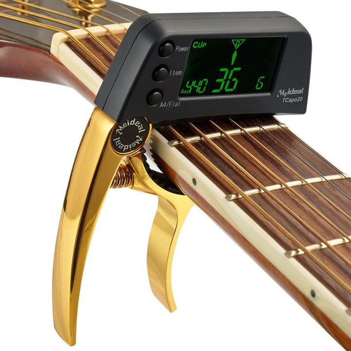 Capo & Tuner "TuneGrip" – 2-i-1 gitar tilbehør med LCD-skjerm | Skanto