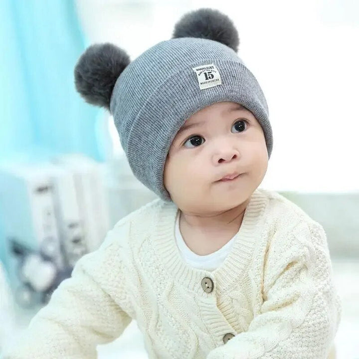 Trendy Barnehatt med Pompom Skanto