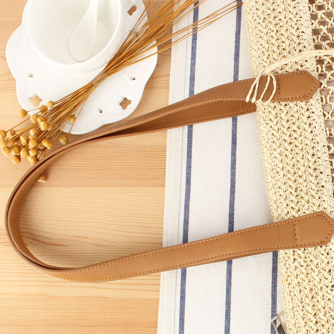 Handbag made of natural woven material with elegant leather straps Skanto