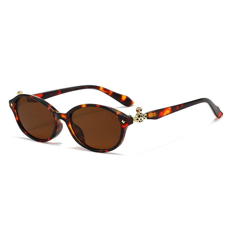Dame motekunstig brille i elegant ova-design med gyldne aksenter Skanto