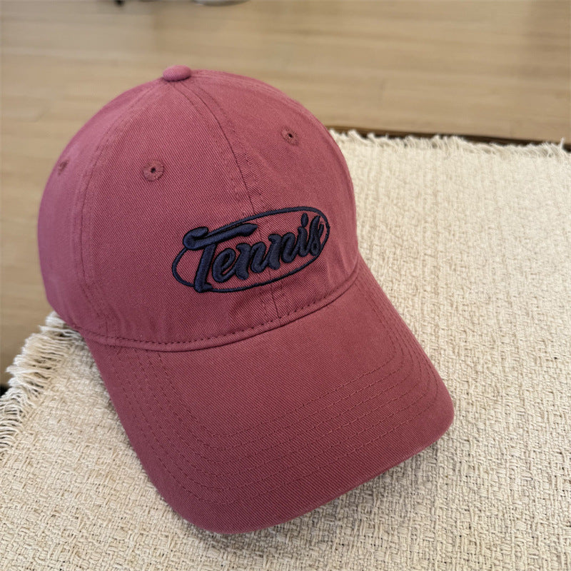 Herresportcaps med tennisgrafikk Skanto