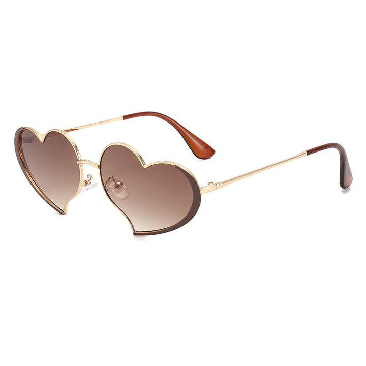 Dame hjerteformet solbrille med glamorøs ramme Skanto