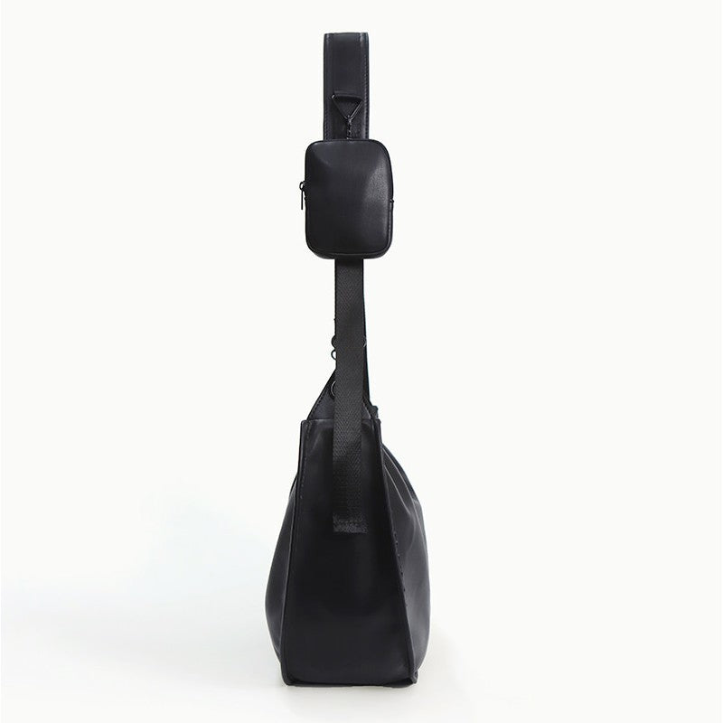 Elegant skulderveske i buet form Skanto