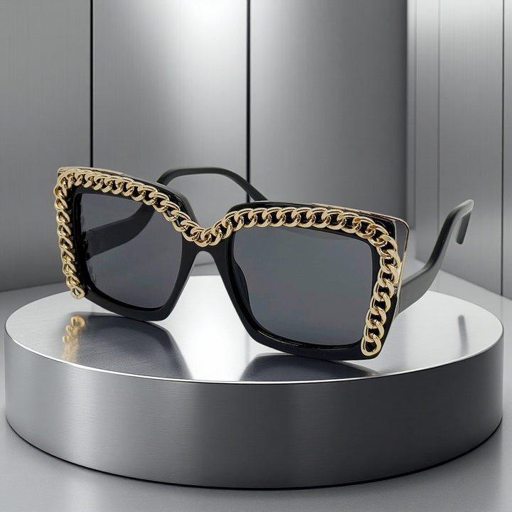 Dame moteriktig oversized solbrille med kjederamme Skanto