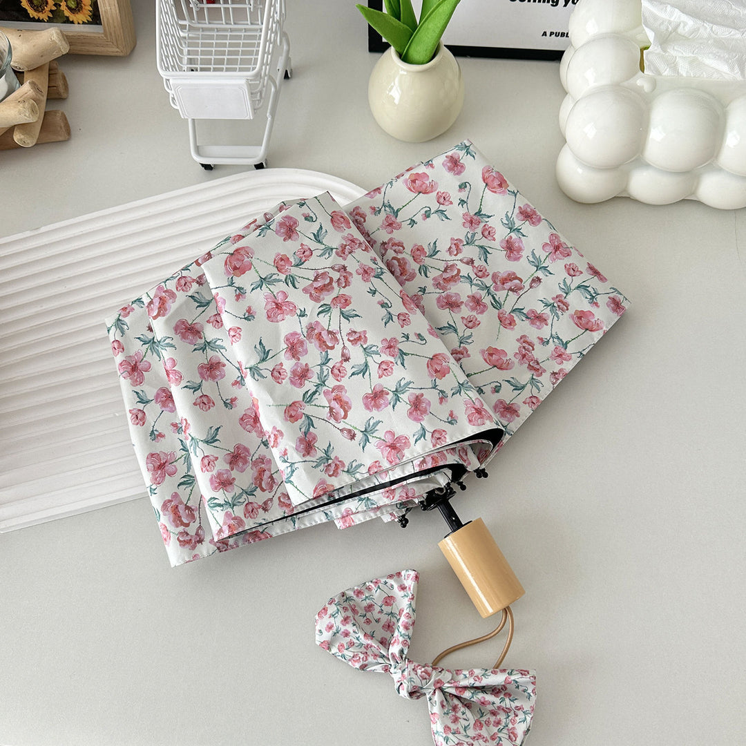 Dame sammenleggbare paraply med blomsterdesign og praktisk oppbevaringssystem Skanto