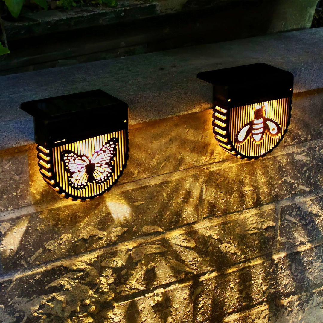 Decorative Solar-Powered Outdoor Wall Lights with Laser-Cut Insect and Flower Panels and Warm LED Ambiance Skanto
