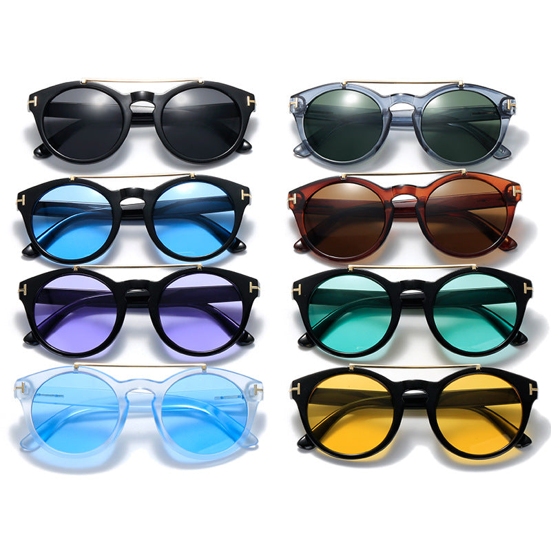 Dame fashionable solbriller med elegante runde glass Skanto