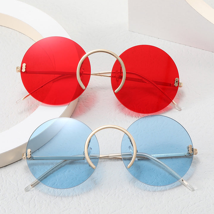 Dame trendy runde solbriller med innovativ metallramme Skanto