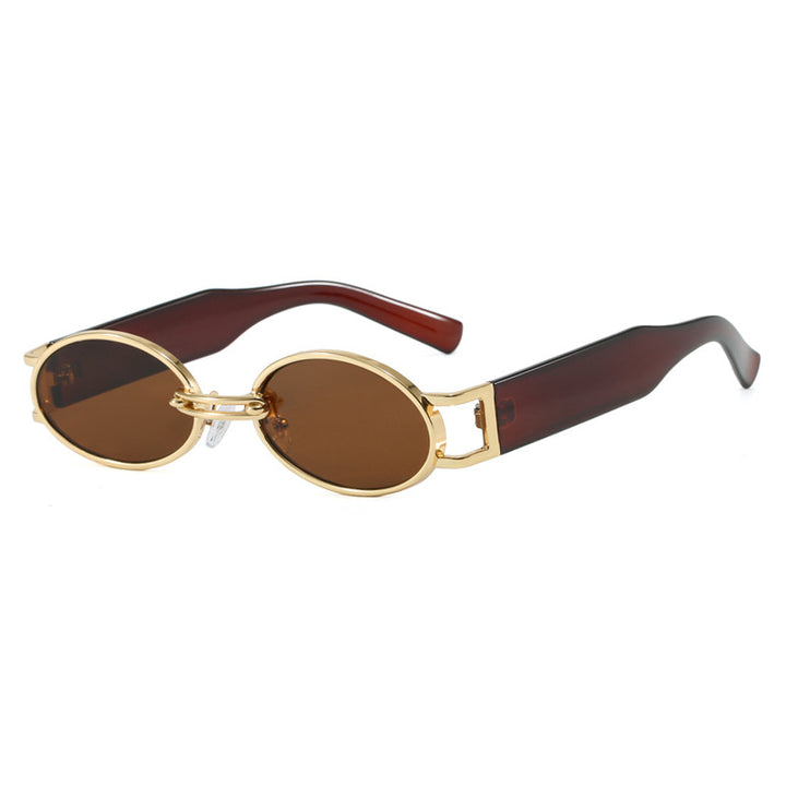 Dame ovalformet solbrille med gullige accenter og stilig ramme Skanto