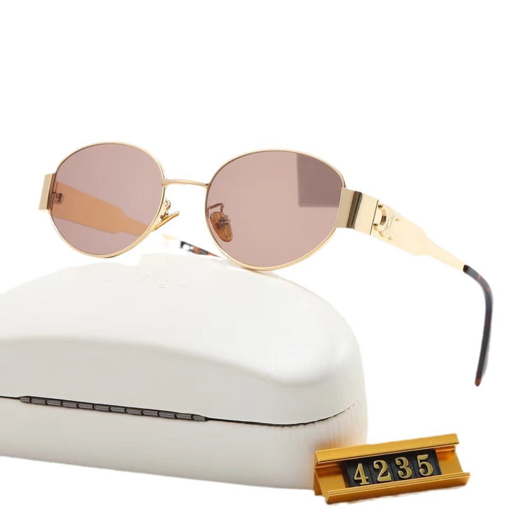 Dame elegant oval solbrille med gullfarget ramme Skanto