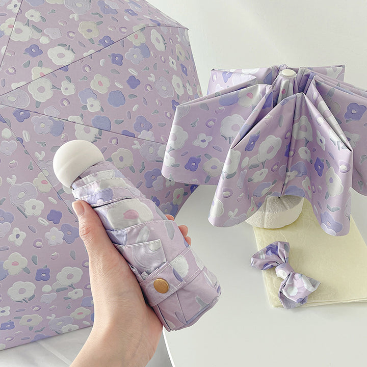 Dame Automatisk sammenleggbart paraply med blomsterdesign og praktisk oppbevaringssystem Skanto