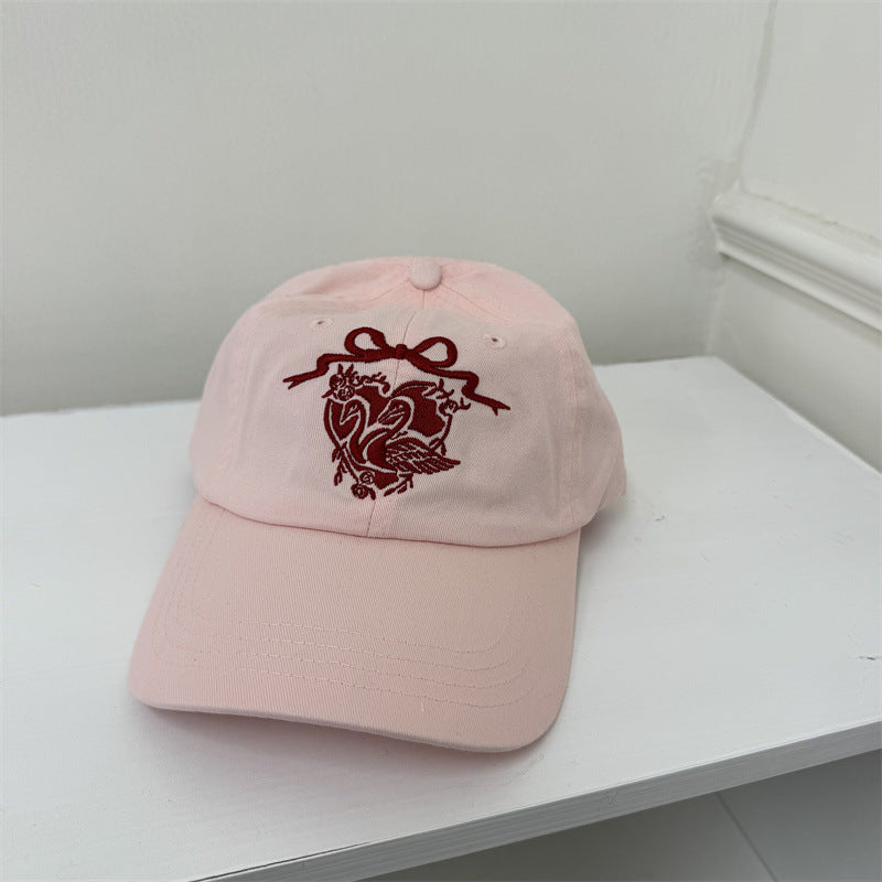 Kvinners broderte svanetema baseball cap Skanto
