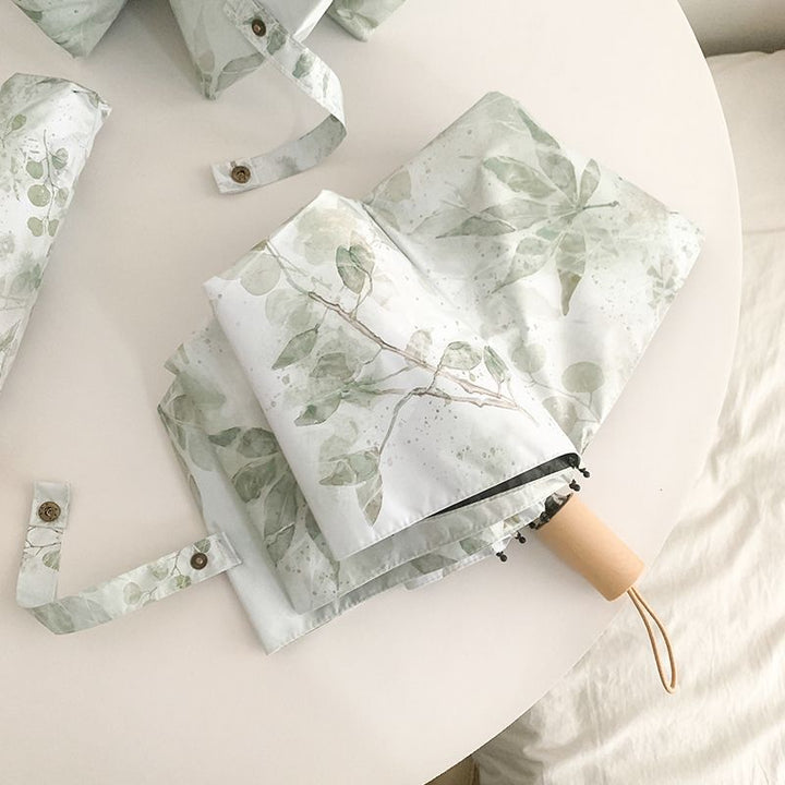 Damer Faltparaply med botanisk trykkdesign Skanto