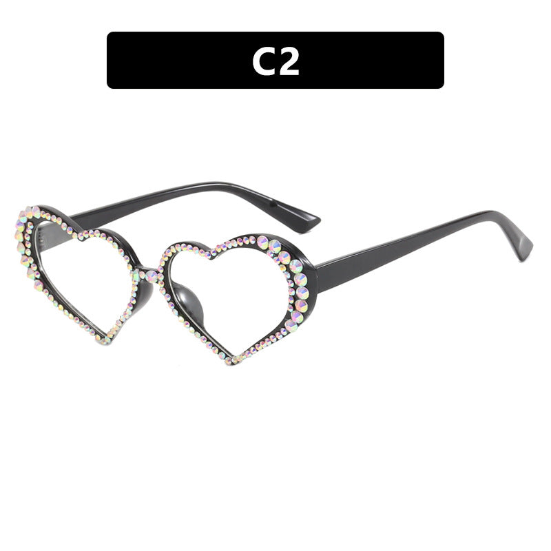 Dame hjerteformet solbrille med strassbesatt ramme Skanto