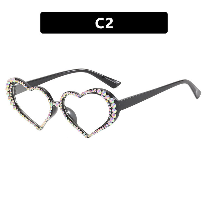 Dame hjerteformet solbrille med strassbesatt ramme Skanto