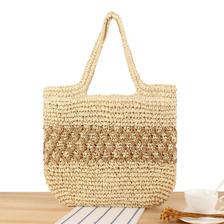Håndlaget bast crossbody bag med florale detaljer Skanto