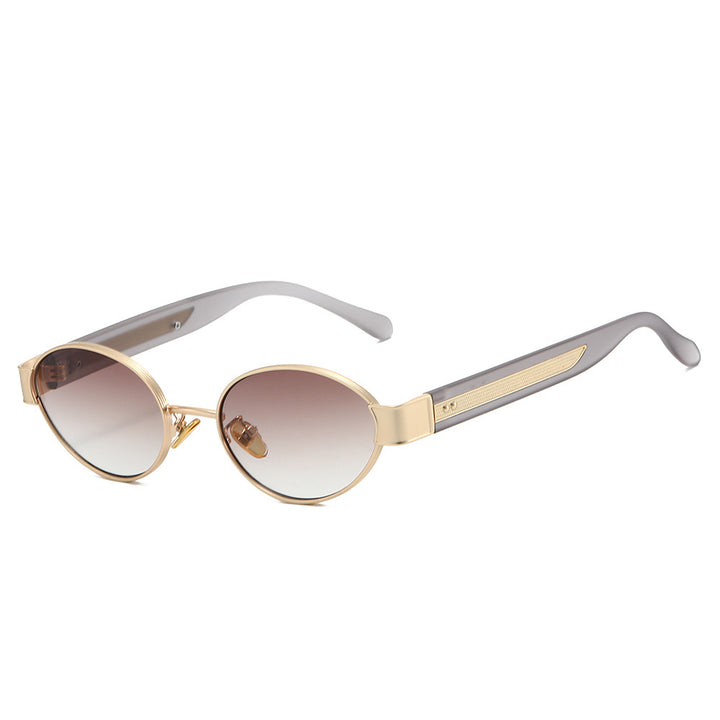 Dame solbrille i moderne, ovale ramme med harmonisk fargekombinasjon Skanto