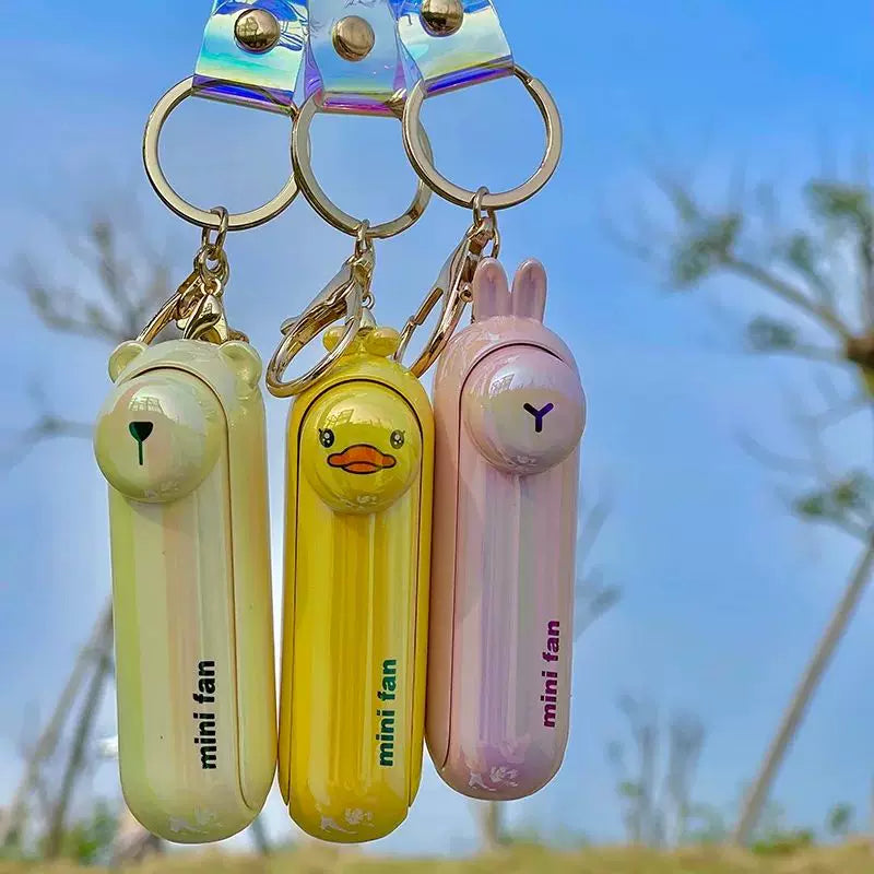 Unisex enhetsstørrelse oppladbar nøkkelring håndholdt mini-vifte med håndleddsstropp og ny art frosk charm Skanto