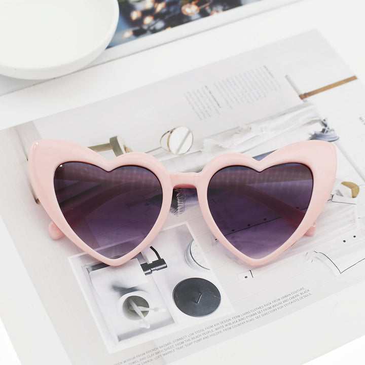 Dame hjerteformet solbrille med glitrende ramme Skanto