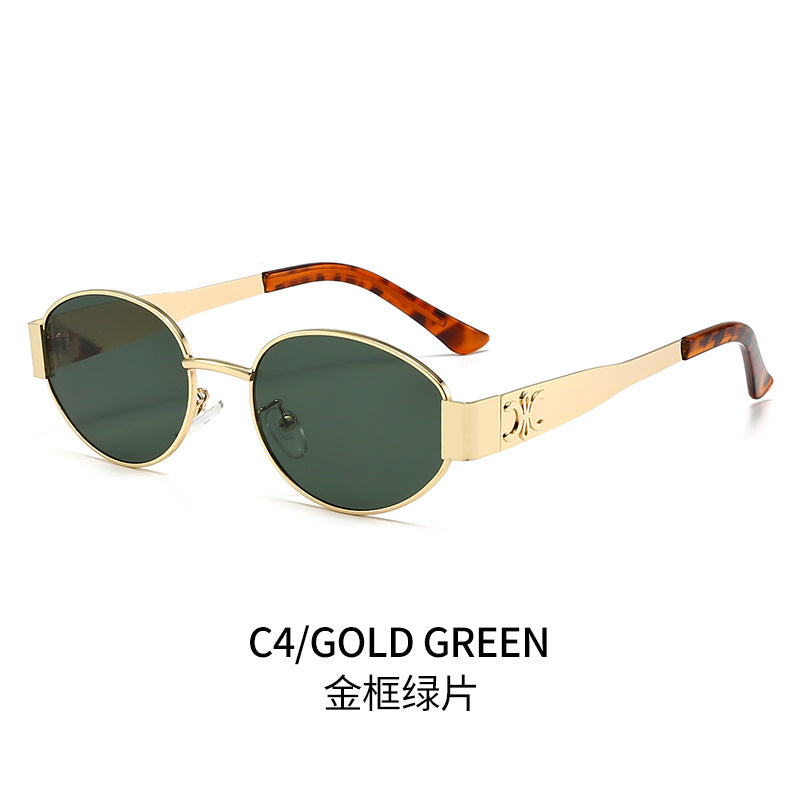 Dame Designer-solbrille med elegant oval ramme og unike aksenter Skanto