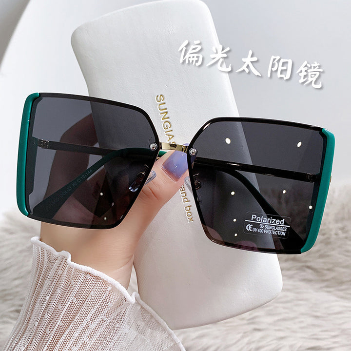 Kvinne polaroid solbriller med elegant oversized ramme Skanto
