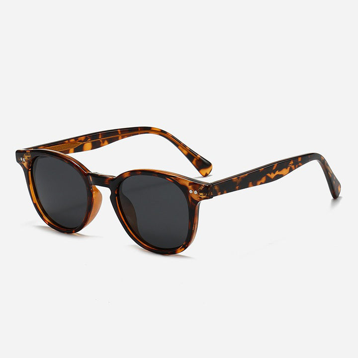 Dame Rund solbrille med stilfullt mønster og UV-beskyttelse Skanto